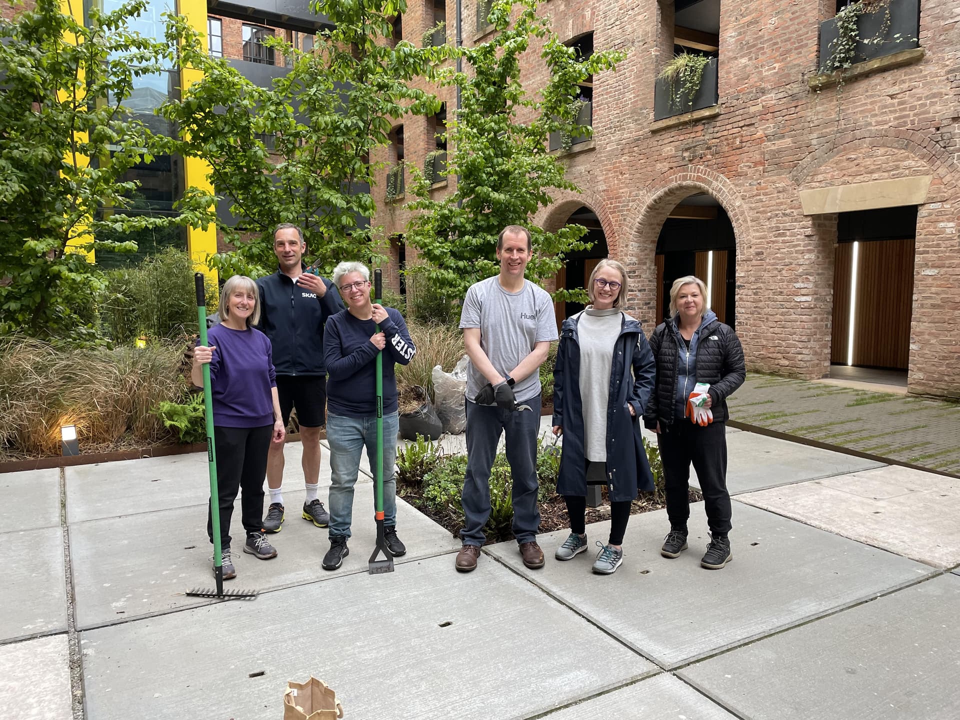 Crusader and Phoenix residents in front of the garden